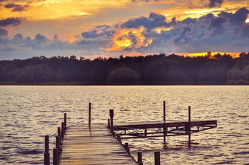 Wooden pier on the lake. Evening landscape on the lake.