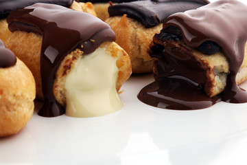 Traditional French dessert. Eclair with chocolate icing. Pastery concept