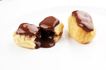 Traditional French dessert. Eclair with chocolate icing. Pastery concept