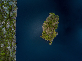 Aerial view of an island with rocky coast