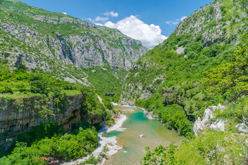 Fototapeta na wymiar The purest waters of the turquoise color of the river Moraca flowing among the canyons. Montenegro.