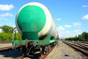 Fototapeta na wymiar Rail tank cars, part of a train with combustible fuel, are at the railway station