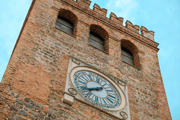 Tower clock is on the center of Moselice, Italy