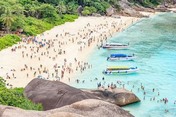 Beautiful view point with blue sky and clouds, blue sea and white sand beach with boat on Similan island, No.8 at Similan national park, Phuket, Thailand is most popular vacation for tourist.
