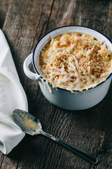Classic Southern baked mac and cheese on rustic background