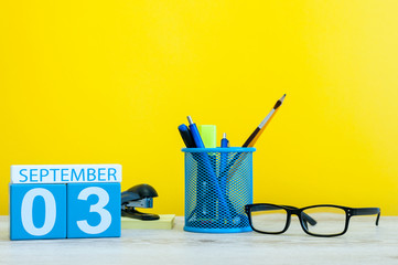 3rd September. Image of september 3, calendar on yellow background with office supplies. Back to school concept