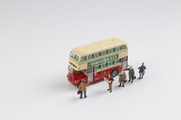 Min travellers at a bus station at board