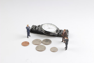 mini figure stack of coins and watch