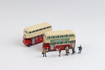 Min travellers at a bus station at board