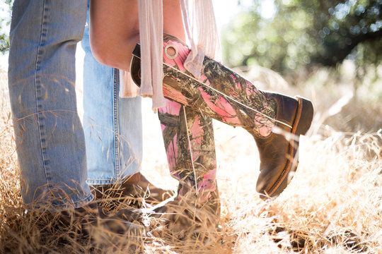 Women and men in cowboy boots. Couple. Country style. Engagement photo. love story