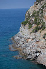 Steep slopes descending to the sea