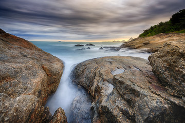 Stunning sunset on the beach and dramatic clouds at the sky. HDR (high dynamic range) picture.