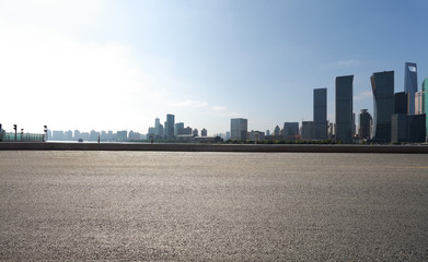 Empty road floor surface with modern city landmark buildings in Shanghai skyline