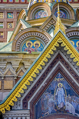 Fototapeta na wymiar Facade details of Savior on the Spilled Blood cathedral with its golden domes and characteristic architecture in St. Petersburg, Russia