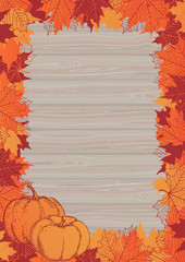 Naklejka na ściany i meble Thanksgiving frame. Vector border with pumpkins and many red and orange maple leaves on wood background