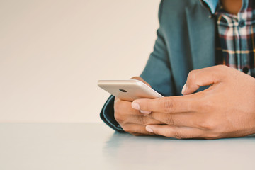 Businessman using smart phone color of vintage tone