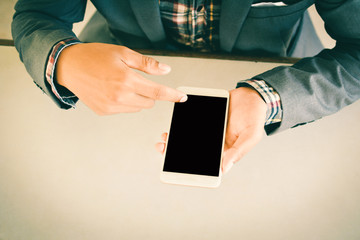 Businessman using smart phone color of vintage tone
