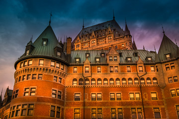 Fototapeta premium Frontenac Castle in Old Quebec City in the beautiful sunrise light. High dynamic range image. Travel, vacation, history, cityscape, nature, summer, hotels and architecture concept