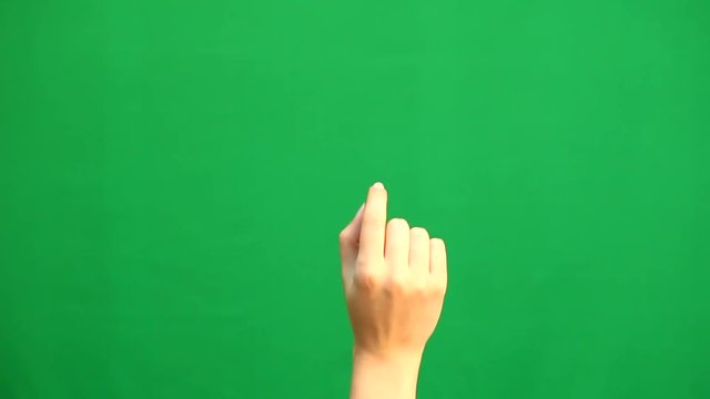 Hand gestures. Touchscreen. Female hand showing multitouch gestures in green screen