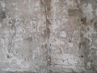 texture of unfinished concrete wall with rough paint surface