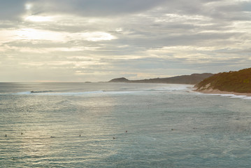 Surfers in ocean waiting for wave