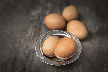 raw eggs on wooden background