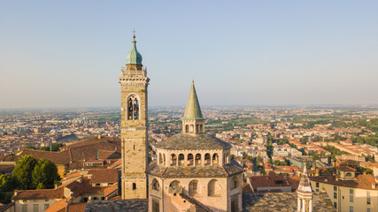 Naklejka premium Bergamo, old city, drone aerial view of the Basilica of Santa Maria Maggiore. On the background the Padana plain