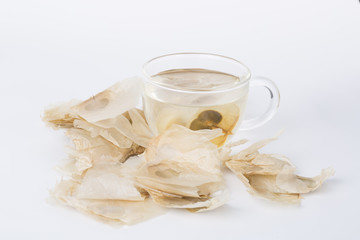 The Oroxylum indicum seed is used in the traditional Indian and Chinese medicine. And using it to make tea in a glass cup.