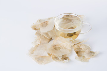 The Oroxylum indicum seed is used in the traditional Indian and Chinese medicine. And using it to make tea in a glass cup.