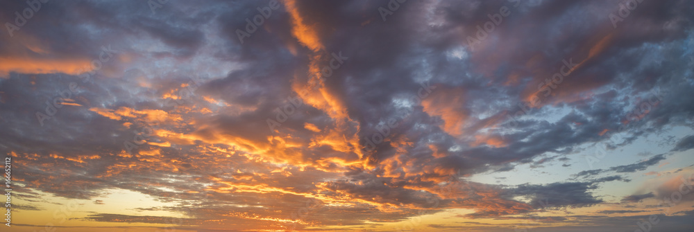 Wall mural fiery sunset, colorful clouds in the sky