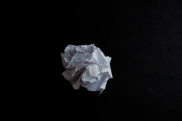 Crumpled sheet of paper to paper ball