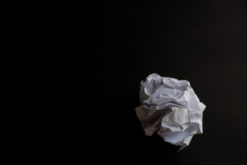 Crumpled sheet of paper to paper ball