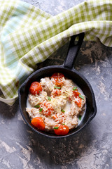 Homemade gnocchi with tomato sauce in frying pan