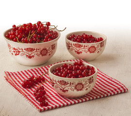 Red currant in bowls on the table