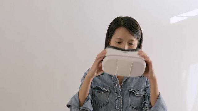 Woman looking though virtual reality headset
