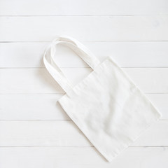 Tote bag mock up canvas fabric cloth shopping sack on white wood