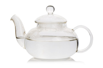 Hot water in a tea pot and on the white background.