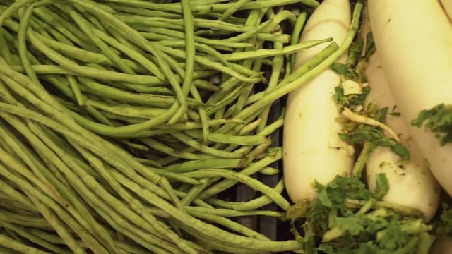Green string beans and radish sold in supermarket stock footage video