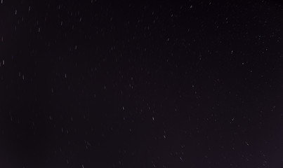 Short star trails - night sky background.