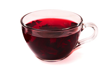 Hibiscus tea in a glass cup .