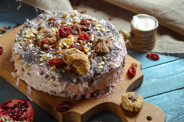 Homemade vegetarian pie with dried fruits on a blue background