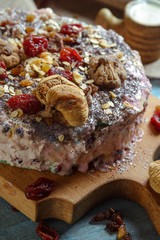 Homemade vegetarian pie with dried fruits on a blue background