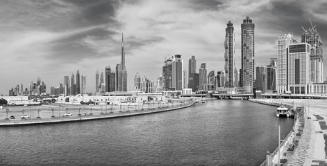 Dubai - The skyline with the bridge over the new Canal and Downtown.