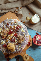 Homemade vegetarian pie with dried fruits on a blue background