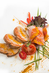 cold boiled pork with tomatoes on a white background