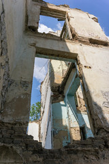 Fototapeta na wymiar The old abandoned overgrown school building