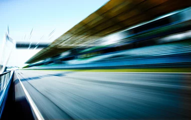 Fotobehang Racebaan in bewegingsonscherpte, race sport achtergrond. © jamesteohart