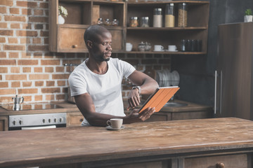 african american man using tablet