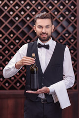 sommelier with bottle of wine