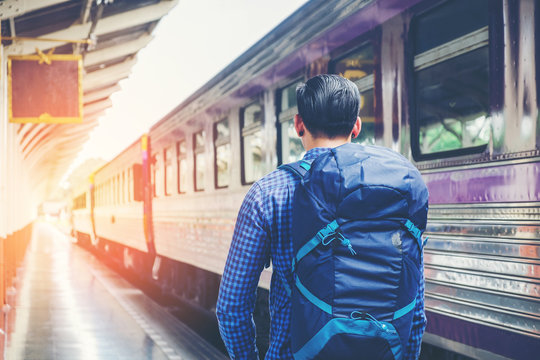 Tourist Man backpacker to travel at train station